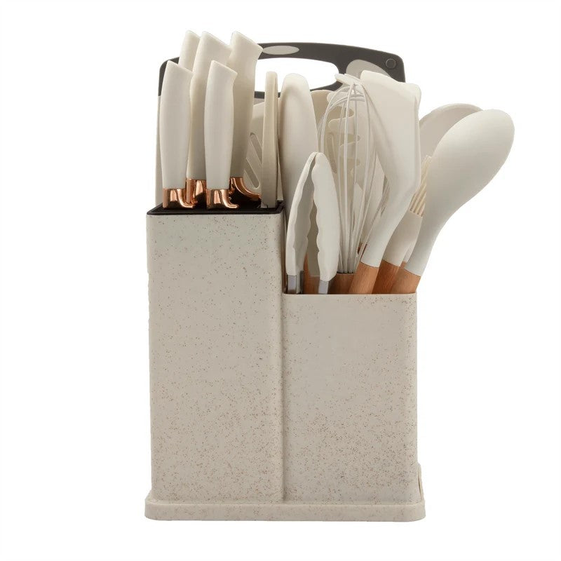 Premium Knife and Utensil Kit White Variant Standing Next to Countertop Fruits